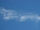 Moon between clouds