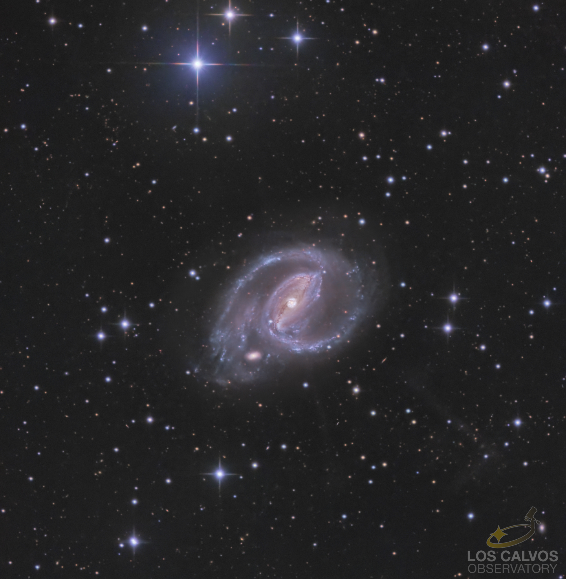 NGC_1097_RGBv2_lps_crop_ABE_DEN_NLGHB_r_sat_PS_DEN_LOGO.jpg